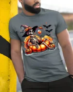 Halloween Skeleton Pumpkin Float T-Shirt - model in grey shirt leaning against column