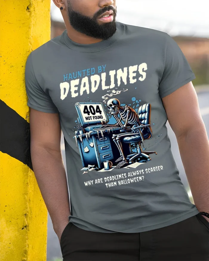 Haunted By Deadlines Funny Skeleton T-Shirt - model in grey shirt leaning against column