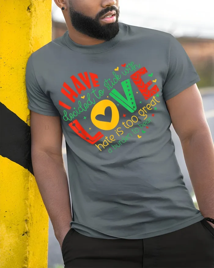 Inspirational Love Over Hate Quote T-Shirt - model in grey shirt leaning against column