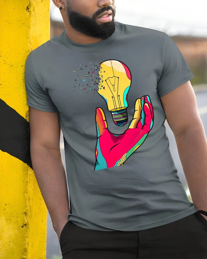Creative Pop Art Light Bulb Graphic T-Shirt - model in grey shirt leaning against column