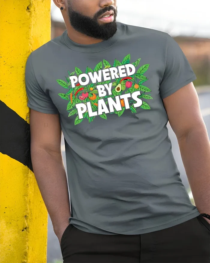Powered By Plants Vegan Lifestyle T-Shirt - model in grey shirt leaning against column