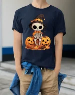 Halloween Cute Skeleton T-Shirt with Pumpkin Duo - model wearing navy shirt, hands in pockets