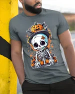 Halloween Cute Skeleton Pumpkin T-Shirt Spooky Fun - model in grey shirt leaning against column