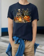 Skeleton Campfire Pumpkin Halloween Tshirt Style - model wearing navy shirt, hands in pockets