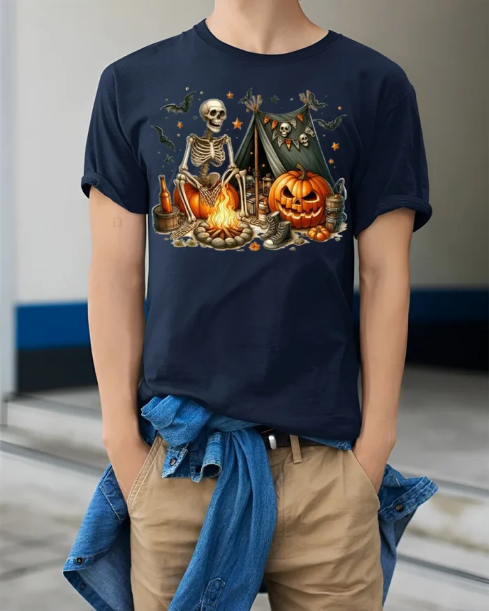 Skeleton Campfire Pumpkin Halloween Tshirt Style - model wearing navy shirt, hands in pockets
