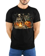 Skeleton Campfire Pumpkin Halloween Tshirt Style - model wearing black shirt, hands behind back