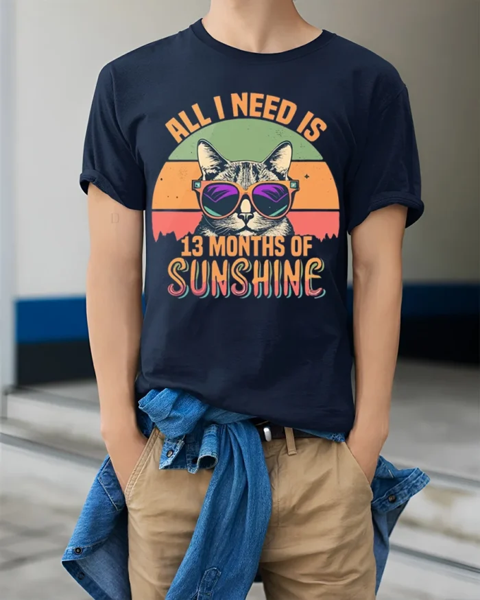 All I Need Is Sunshine Cat Tshirt Retro Summer Tee - model wearing navy shirt, hands in pockets