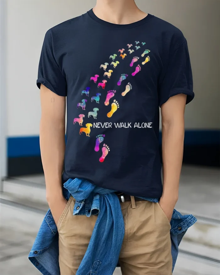 Never Walk Alone Dog Lover Tshirt Colorful Print - model wearing navy shirt, hands in pockets