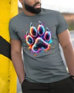 Colorful Paw Print Tshirt Vibrant Animal Art Tee - model in grey shirt leaning against column