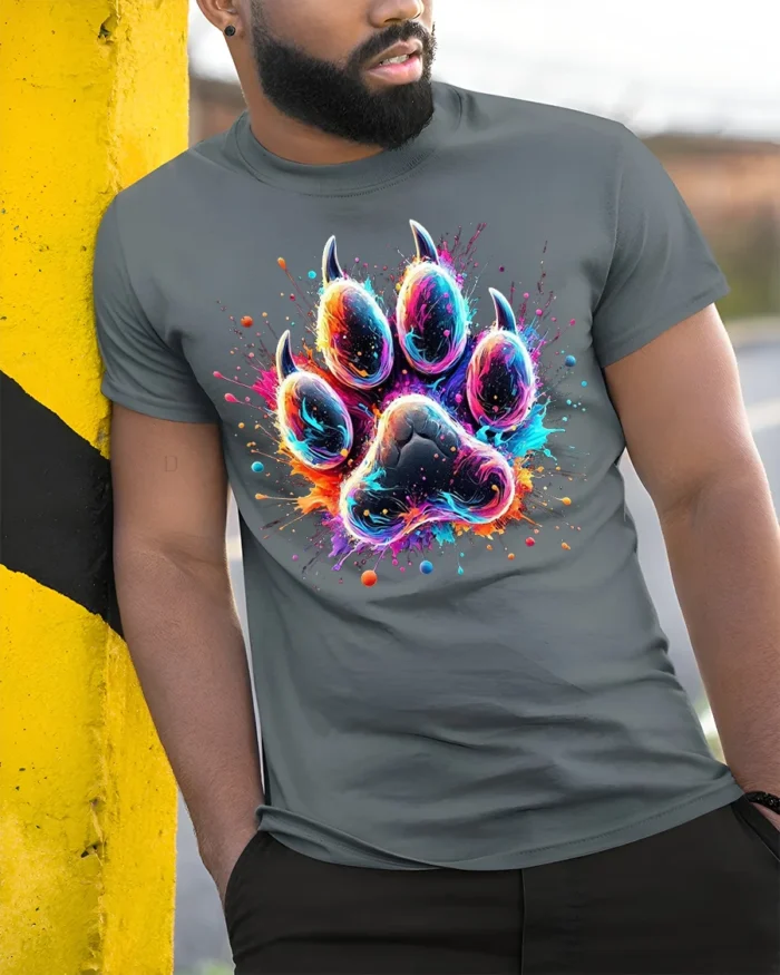 Colorful Paw Print Tshirt Vibrant Animal Art Tee - model in grey shirt leaning against column