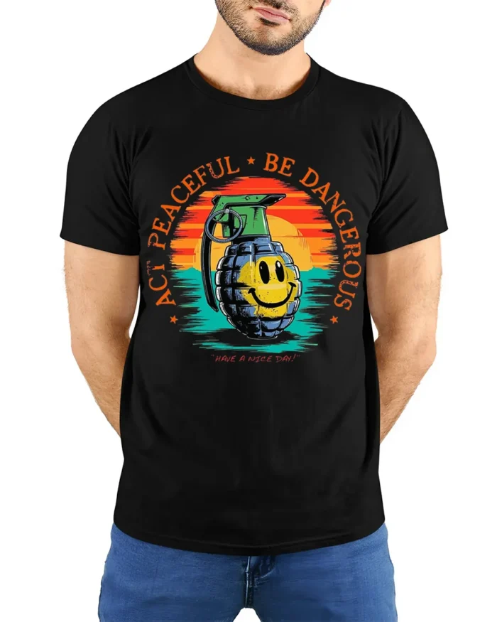 Act Peaceful Be Dangerous Graphic T-Shirt Tee - model wearing black shirt, hands behind back
