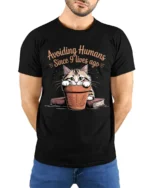 Avoiding Humans Funny Cat Graphic T-Shirt Tee - model wearing black shirt, hands behind back