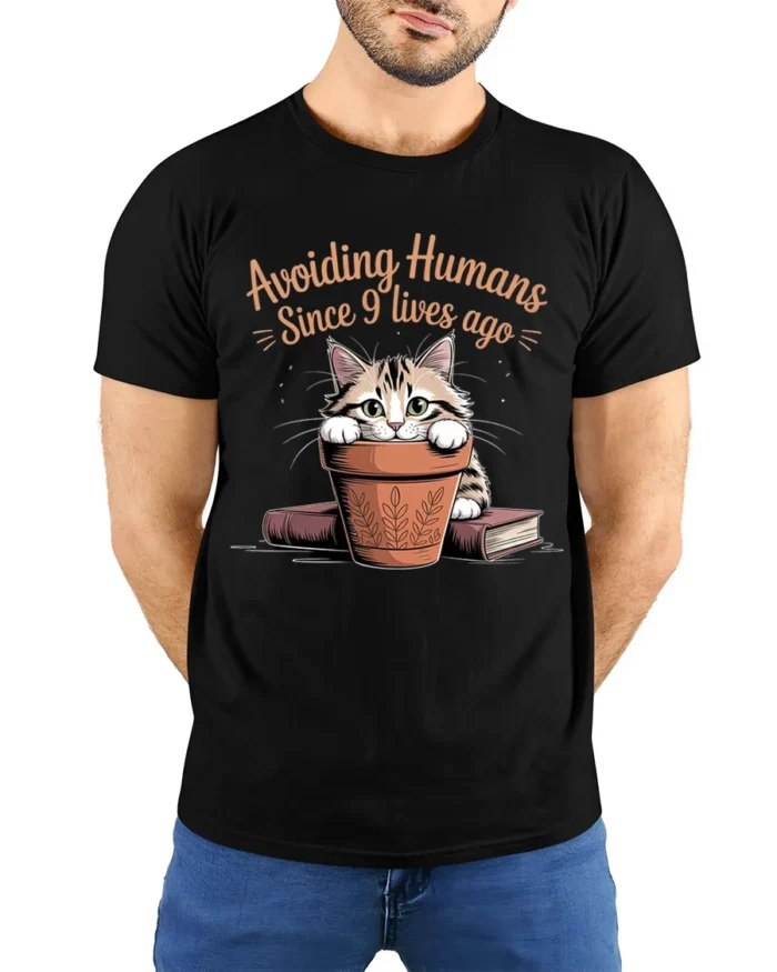 Avoiding Humans Funny Cat Graphic T-Shirt Tee - model wearing black shirt, hands behind back