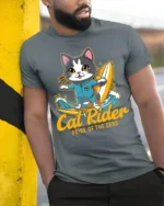Cat Rider Surfing Graphic T-Shirt for Ocean Lovers - model in grey shirt leaning against column