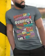 Colorful Retro Typography Graphic Quote T-Shirt - model in grey shirt leaning against column