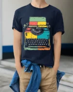 Retro Colorful Typewriter Graphic Printed T-Shirt - model wearing navy shirt, hands in pockets