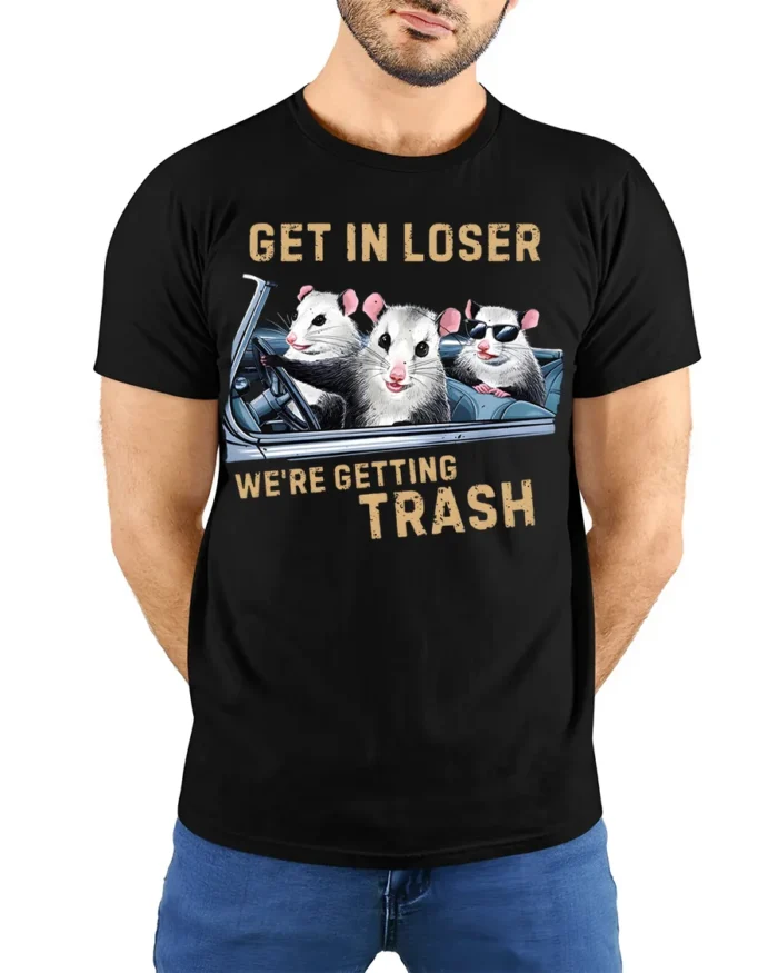 Funny Opossum Get In Loser Trash Graphic T-Shirt - model wearing black shirt, hands behind back