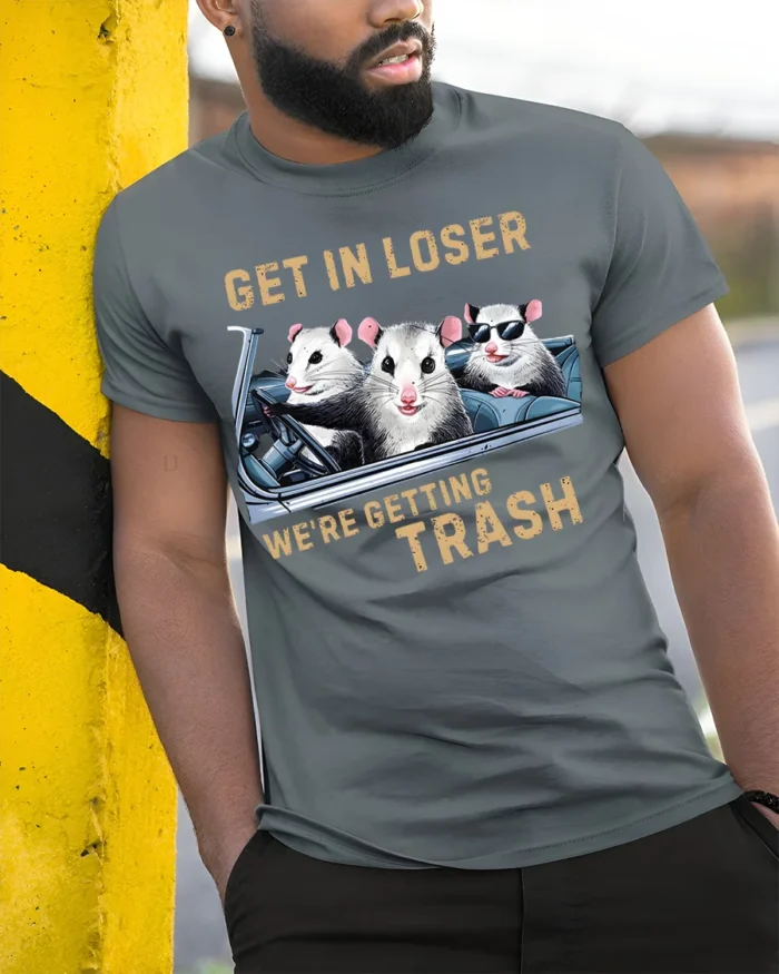 Funny Opossum Get In Loser Trash Graphic T-Shirt - model in grey shirt leaning against column