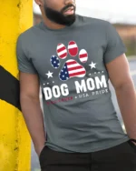 Patriotic Dog Mom USA Flag Paw Print Graphic T-Shirt - model in grey shirt leaning against column