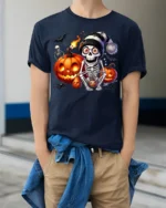 Skeleton Pumpkin Halloween Night Graphic T-Shirt - model wearing navy shirt, hands in pockets
