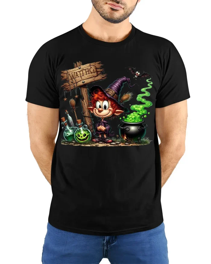 Cartoon Witch Halloween Cauldron Magic T-Shirt - model wearing black shirt, hands behind back