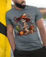 Cute Mummy Witch Halloween Pumpkin Graphic T-Shirt - model in grey shirt leaning against column