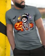 Skeleton Pumpkin Halloween Night Graphic T-Shirt - model in grey shirt leaning against column
