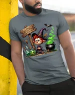 Cartoon Witch Halloween Cauldron Magic T-Shirt - model in grey shirt leaning against column