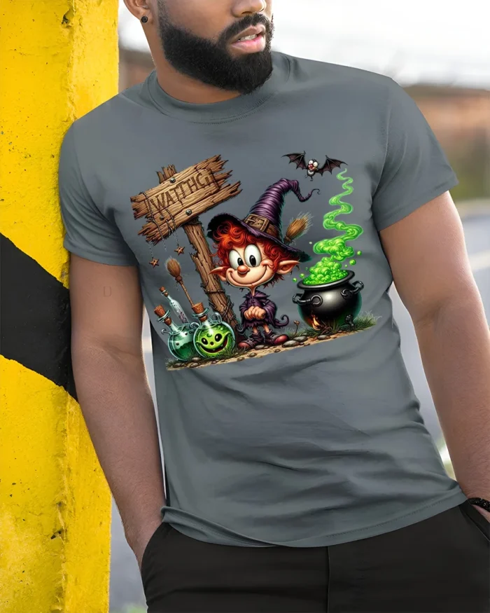 Cartoon Witch Halloween Cauldron Magic T-Shirt - model in grey shirt leaning against column
