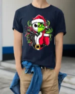 Christmas Grinch Skeleton Santa Mashup T-Shirt - model wearing navy shirt, hands in pockets