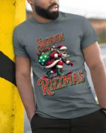 Funny Skibidi Rizzmas Santa Skateboard T-Shirt - model in grey shirt leaning against column
