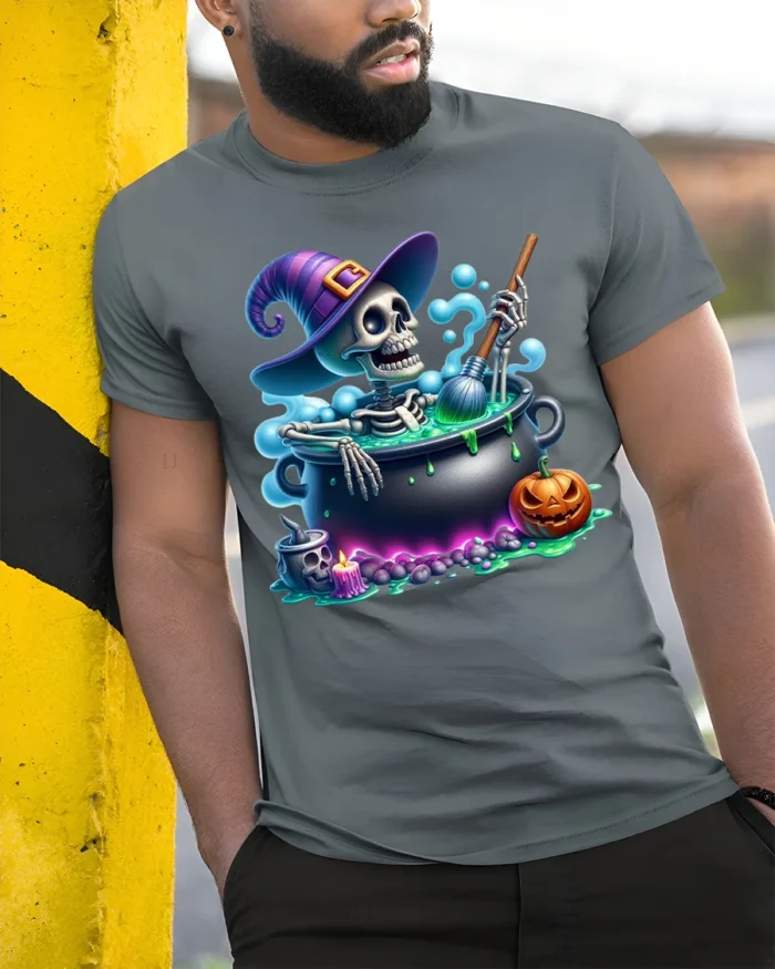 Funny Skeleton Witch Cauldron Halloween T-Shirt - model in grey shirt leaning against column