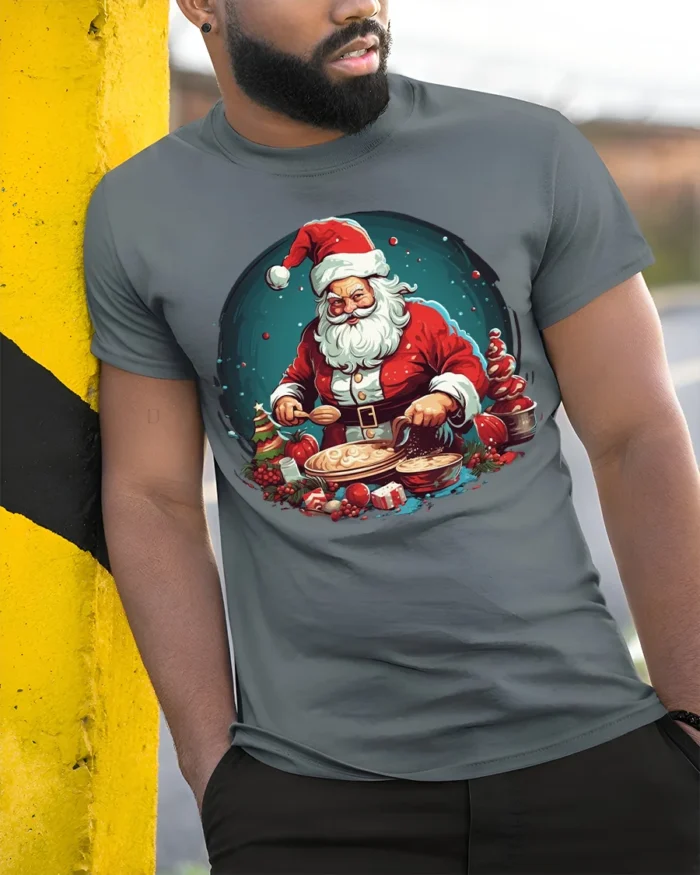 Santa Baking Christmas Cookies Graphic T-Shirt - model in grey shirt leaning against column