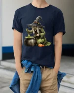 Witch Stirring Cauldron Pumpkin Halloween T-Shirt - model wearing navy shirt, hands in pockets