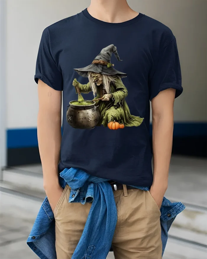 Witch Stirring Cauldron Pumpkin Halloween T-Shirt - model wearing navy shirt, hands in pockets