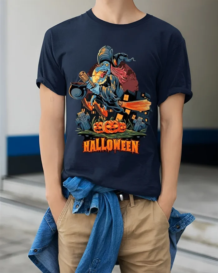 Flying Witch Broomstick Pumpkin Halloween Graphic T-Shirt - model wearing navy shirt, hands in pockets