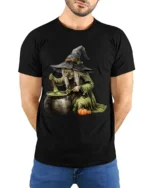 Witch Stirring Cauldron Pumpkin Halloween T-Shirt - model wearing black shirt, hands behind back