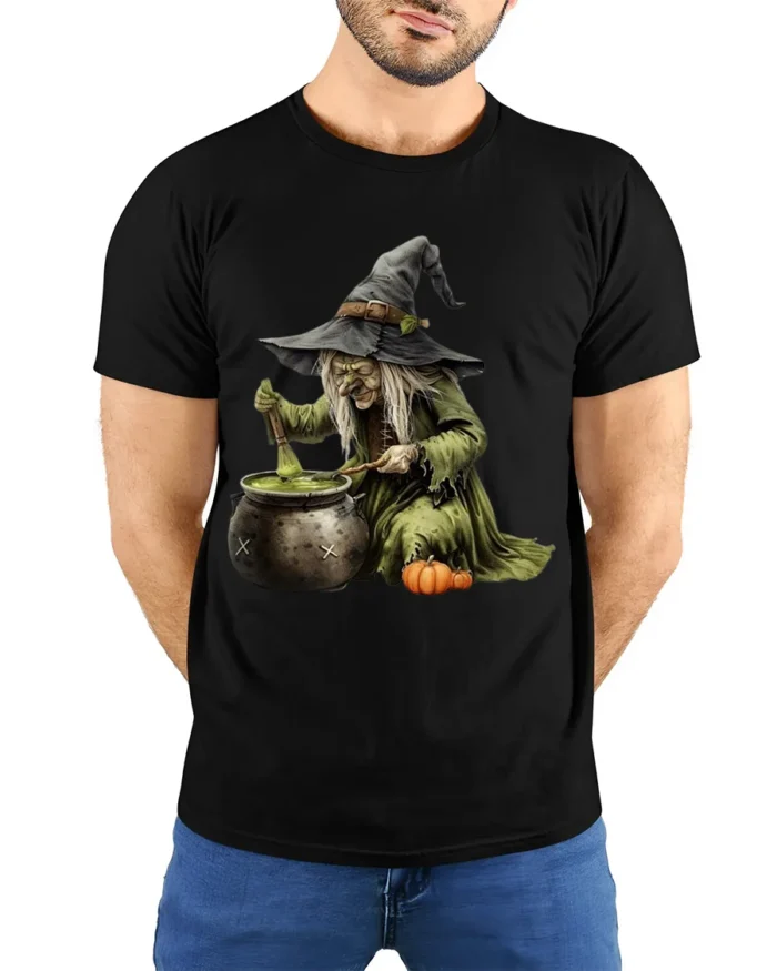 Witch Stirring Cauldron Pumpkin Halloween T-Shirt - model wearing black shirt, hands behind back
