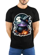 Witch Cauldron Pumpkin Moon Halloween Graphic T-Shirt - model wearing black shirt, hands behind back