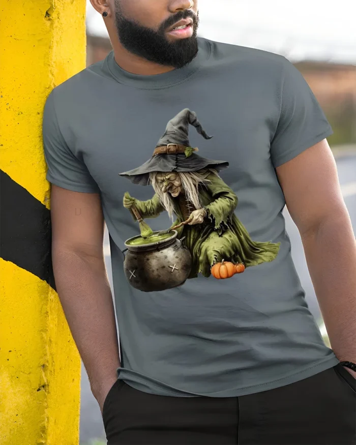Witch Stirring Cauldron Pumpkin Halloween T-Shirt - model in grey shirt leaning against column