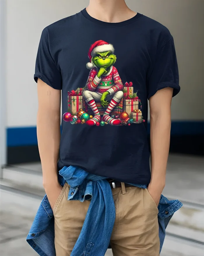 Grumpy Green Santa Christmas Gifts Funny Graphic Tshirt - model wearing navy shirt, hands in pockets