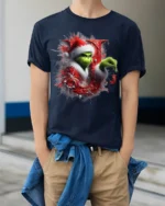 Green Santa Naughty Joy Christmas Funny Graphic Tshirt - model wearing navy shirt, hands in pockets