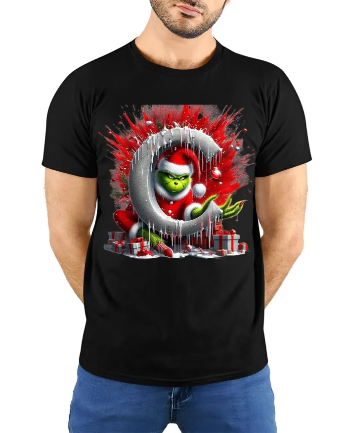Mischief Green Santa Christmas Naughty Graphic Tshirt - model wearing black shirt, hands behind back