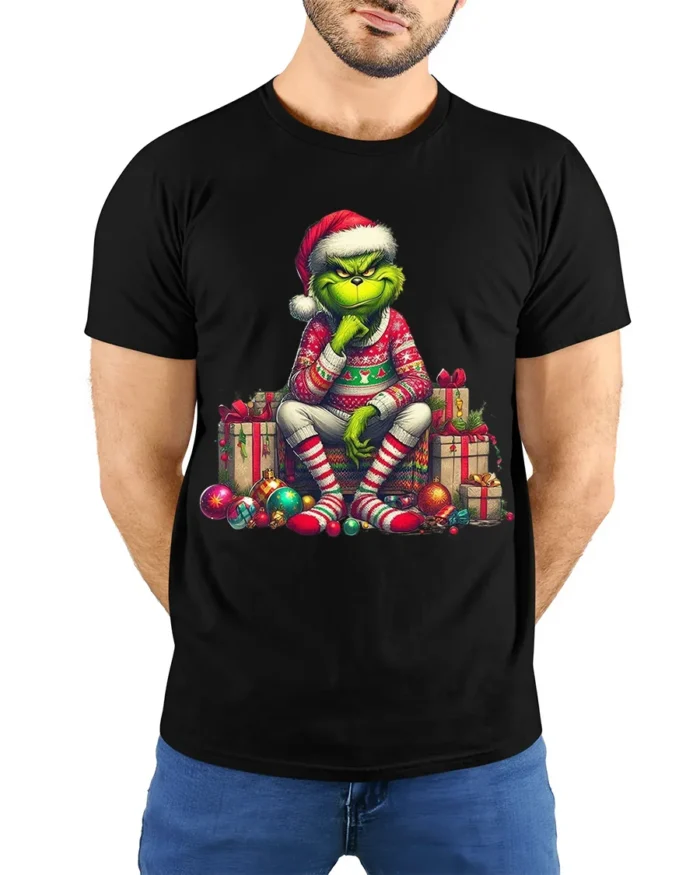 Grumpy Green Santa Christmas Gifts Funny Graphic Tshirt - model wearing black shirt, hands behind back