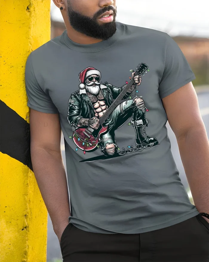 Rockstar Santa Guitar Christmas Holiday Graphic Tshirt - model in grey shirt leaning against column