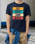 Eat Sleep Game Repeat Funny Gamer Lifestyle T Shirt - model wearing navy tee with hands in pockets