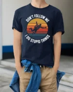 Dont Follow Me I Do Stupid Things Funny T Shirt - model wearing navy tee with hands in pockets
