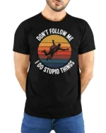 Dont Follow Me I Do Stupid Things Funny T Shirt - model wearing black tee with hands behind back