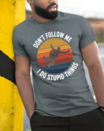 Dont Follow Me I Do Stupid Things Funny T Shirt - model wearing grey tee, leaning on column