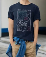 Game On Never Say Game Over Gamer Controller Graphic T Shirt - model wearing navy tee with hands in pockets